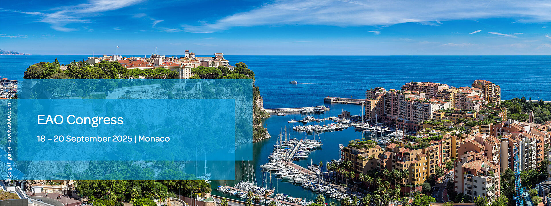 Scenic photo of Monaco with a wide view of the sea in the background and harbor, mountains and city in the foreground.